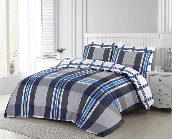 A bright, modern bedroom features a neatly made bed dressed in the BRIT DIAMOND Luxury White Bedding Set with a reversible grey duvet cover, complemented by white walls, a bedside table with lamp, and a potted plant on the window sill.