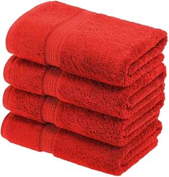 A pack of four BRIT DIAMOND soft & absorbent hand towels, made from 100% cotton for quick-dry use, is neatly folded and stacked against a white background.
