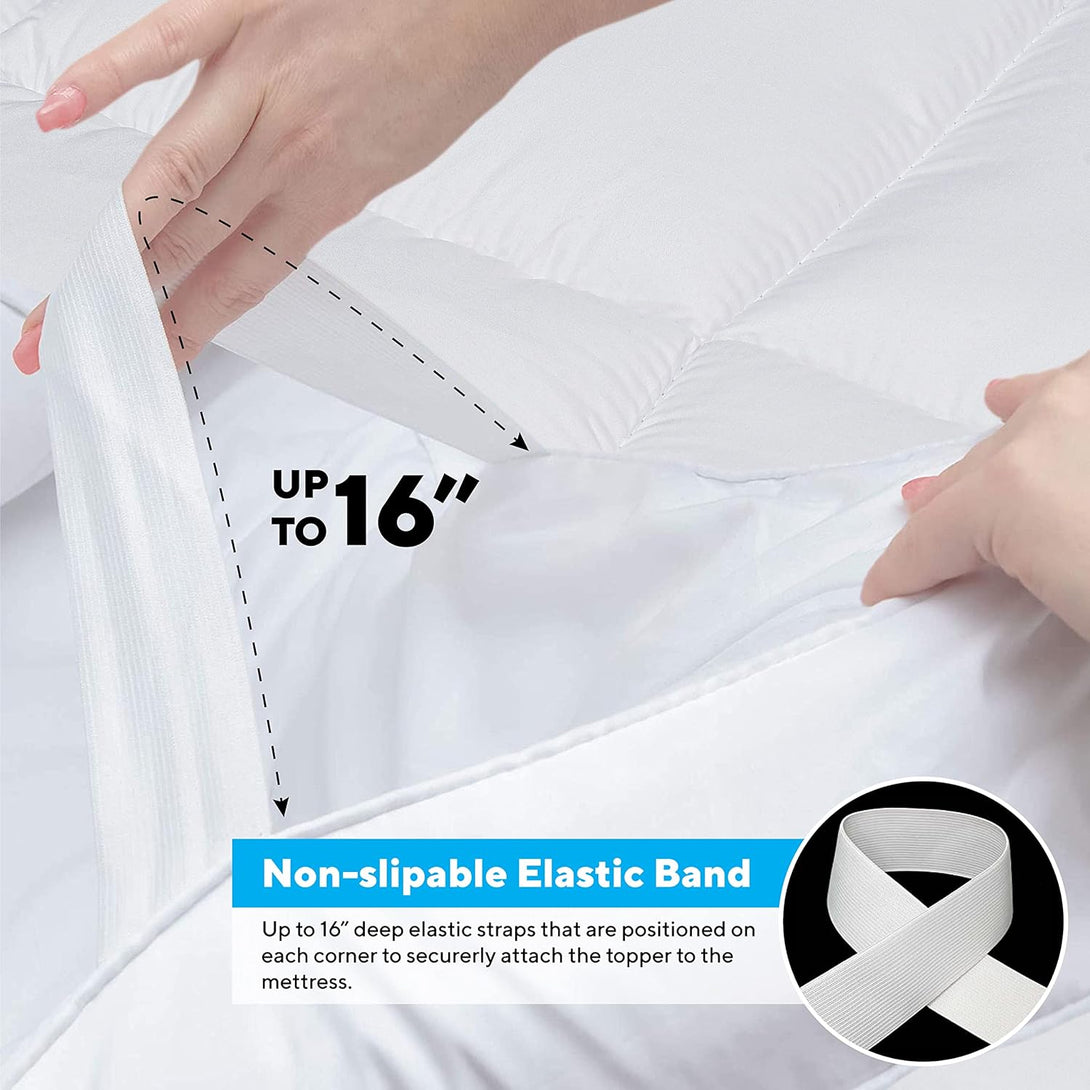A hand stretches a white elastic band on the BRIT DIAMOND Extra Deep Mattress Topper (10cm thick), showing it fits mattresses up to 16 deep. Non-slip elastic bands and extra deep filling keep the hypoallergenic topper secure.