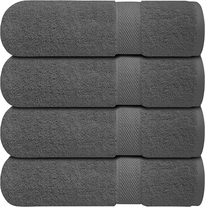 Four BRIT DIAMOND bath sheets, crafted from 100% cotton in dark gray, are stacked and display soft, absorbent texture with decorative bands. Available as a pack of 2 or 4 large towels.