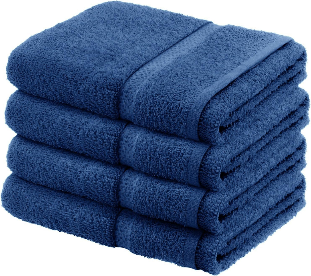 A stack of four BRIT DIAMOND 100% cotton bath sheets in dark blue, soft and absorbent, displayed on a white background. Available as a pack of 2 or 4 large towels in multiple colours.