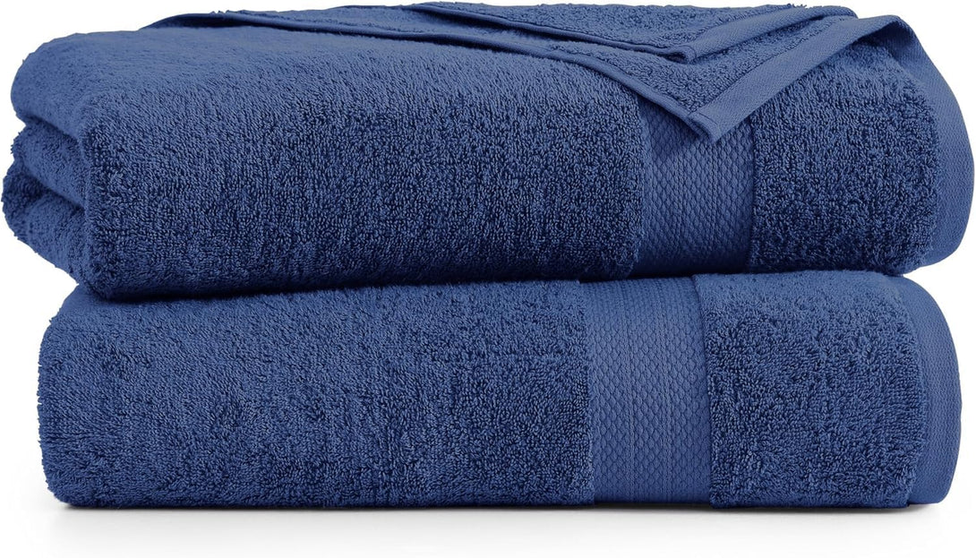 Two dark blue BRIT DIAMOND bath sheets, 100% cotton, quick-dry and ultra soft, are neatly stacked with one partially overlapping the other—showcasing this pack of 2 large, highly absorbent premium towels.