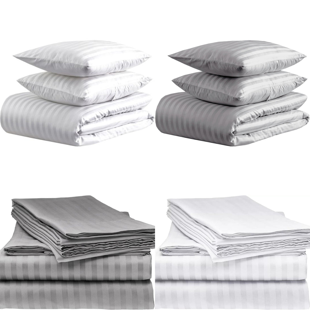 Four stacks of BRIT DIAMOND Luxury 400 Thread Count Satin Stripe Bedding Duvet Sets, made from 100% Egyptian cotton, are arranged in two rows. Each stack features quilt covers with a subtle striped pattern for hotel-quality comfort.