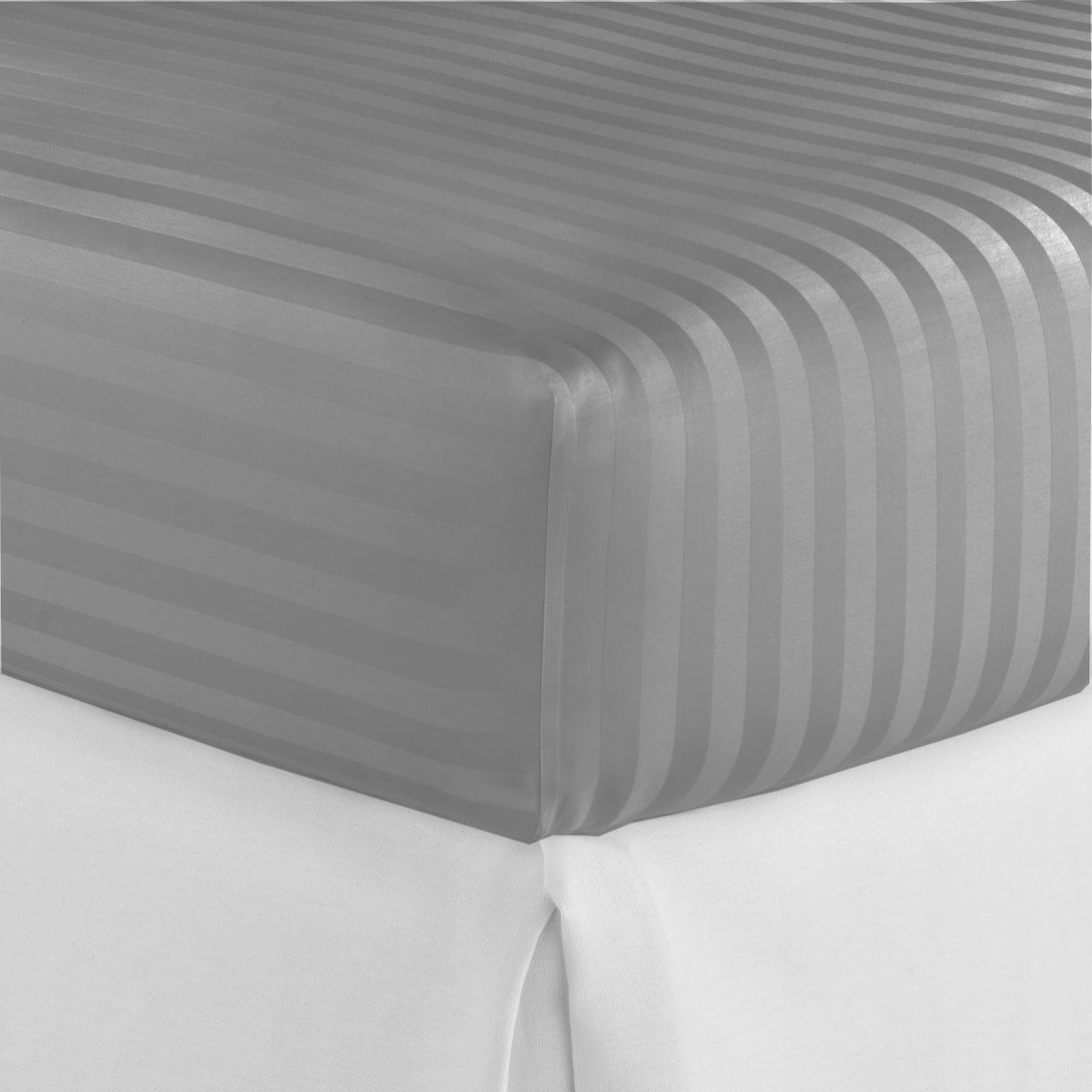Close-up of the BRIT DIAMOND Stripe Extra Deep Fitted Sheet, made from 100% Egyptian cotton (400TC), in gray with a subtle stripe pattern, neatly fitted on a mattress over a white bottom sheet. Available in Double & King sizes.