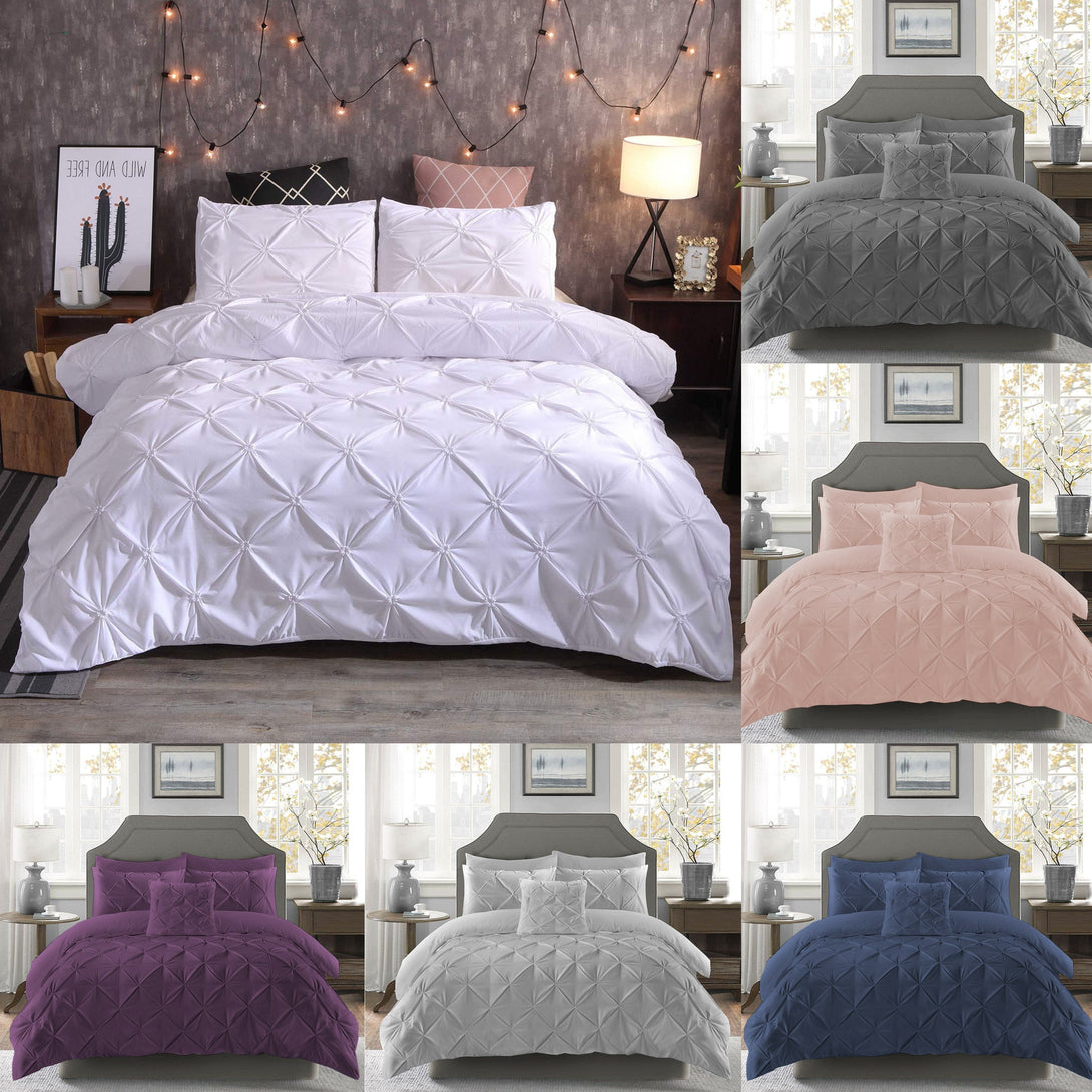 The BRIT DIAMOND Pintuck Duvet Set, made of 100% Egyptian cotton, is displayed in white on a cozy bed, with alternate color options—gray, blush pink, purple, light gray, and navy—shown on the side and bottom of the image.