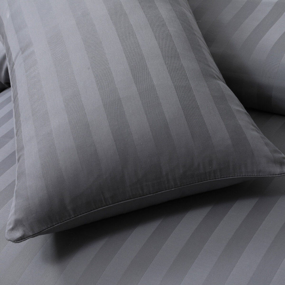 Close-up of gray BRIT DIAMOND bedding with subtle satin stripes. This Luxury 400 Thread Count Duvet Set is crafted from 100% Egyptian cotton for a smooth, soft, hotel-quality feel.